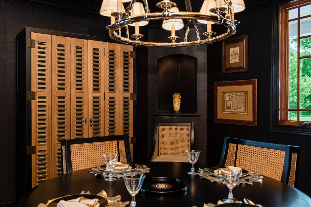 This is an example of an eclectic separate dining room in Indianapolis with black walls.