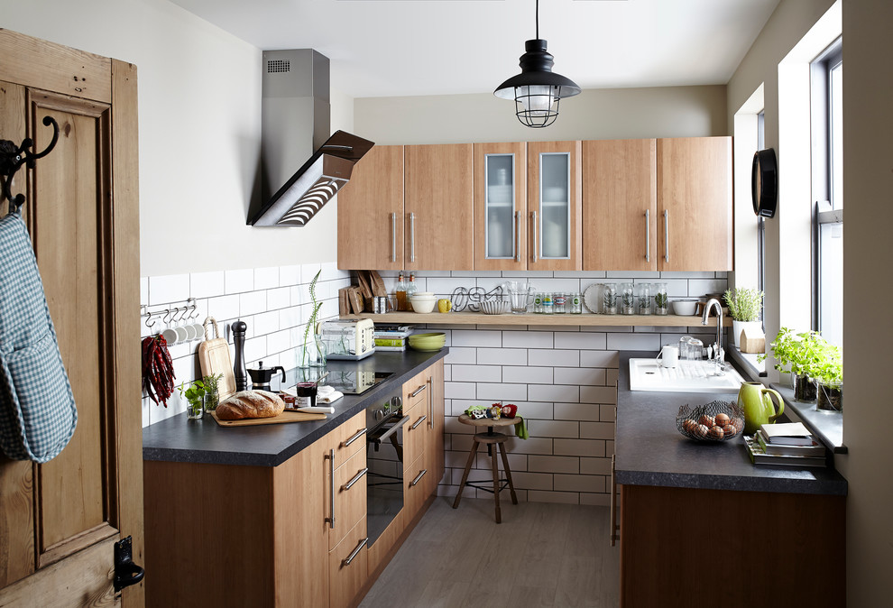Design ideas for a mid-sized country u-shaped separate kitchen in Hampshire with flat-panel cabinets, medium wood cabinets, white splashback, subway tile splashback and no island.