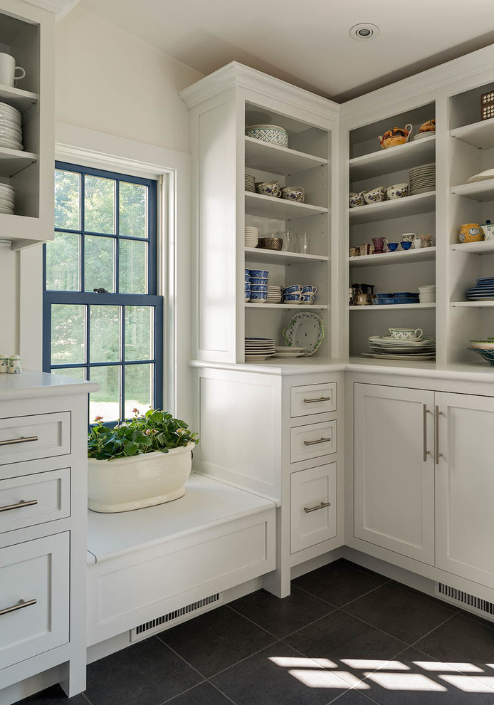 Large eclectic dedicated laundry room in Bridgeport with shaker cabinets, white cabinets, a side-by-side washer and dryer, wood benchtops, white walls, ceramic floors and grey floor.