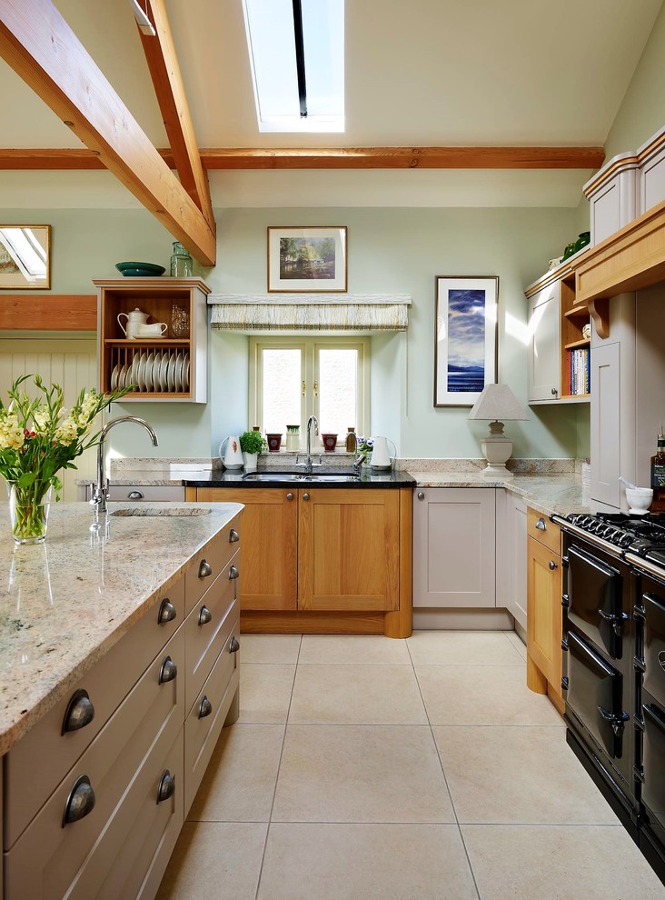 Inspiration for a country l-shaped kitchen in Other with an undermount sink, shaker cabinets, beige cabinets, black appliances, with island, beige floor and beige benchtop.