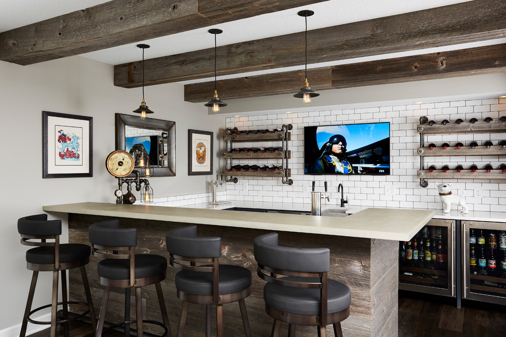 Design ideas for an industrial seated home bar in Minneapolis with an undermount sink, white splashback, subway tile splashback and dark hardwood floors.