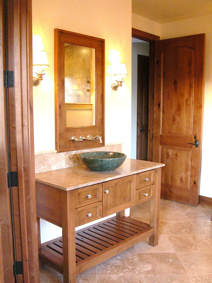 Example of a large transitional master beige tile and ceramic tile travertine floor alcove shower design in Albuquerque with a vessel sink, furniture-like cabinets, medium tone wood cabinets, granite countertops and beige walls