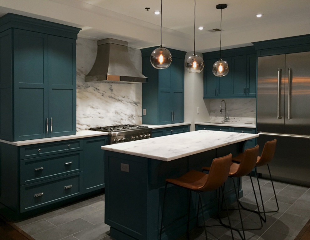 Photo of a mid-sized contemporary l-shaped eat-in kitchen in New York with an undermount sink, shaker cabinets, turquoise cabinets, marble benchtops, yellow splashback, stone slab splashback, stainless steel appliances, slate floors, with island, grey floor and yellow benchtop.