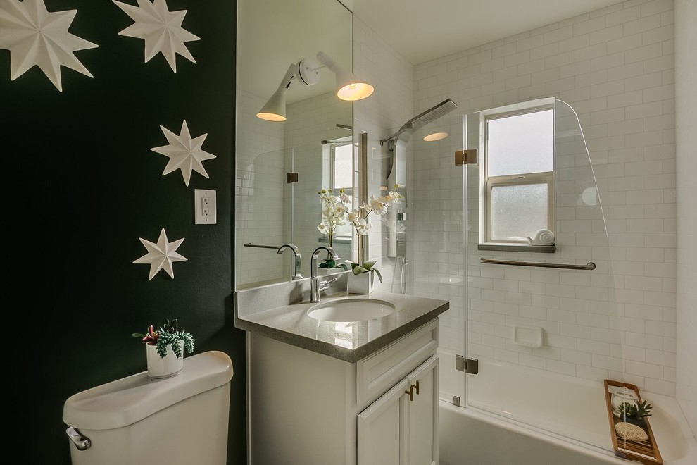 Inspiration for a small transitional white tile and subway tile alcove bathtub remodel in Phoenix with recessed-panel cabinets, white cabinets, a two-piece toilet, white walls, an undermount sink and a hinged shower door