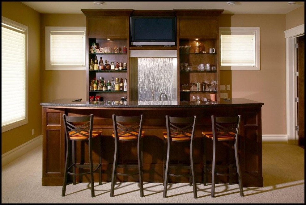 Design ideas for a traditional home bar in Calgary.