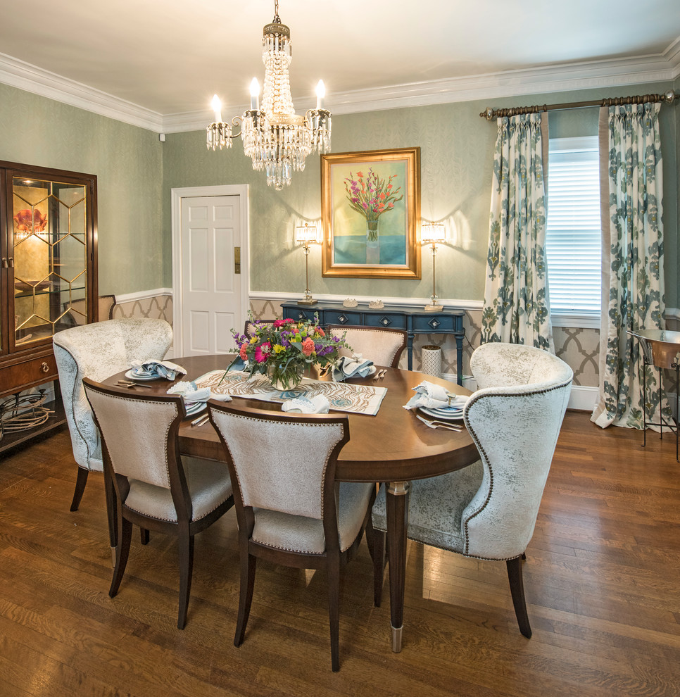 Photo of a mid-sized transitional dining room in Raleigh with medium hardwood floors and green walls.