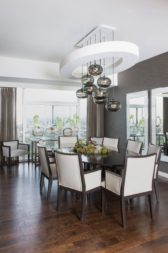 Design ideas for a transitional open plan dining in Los Angeles with white walls and dark hardwood floors.