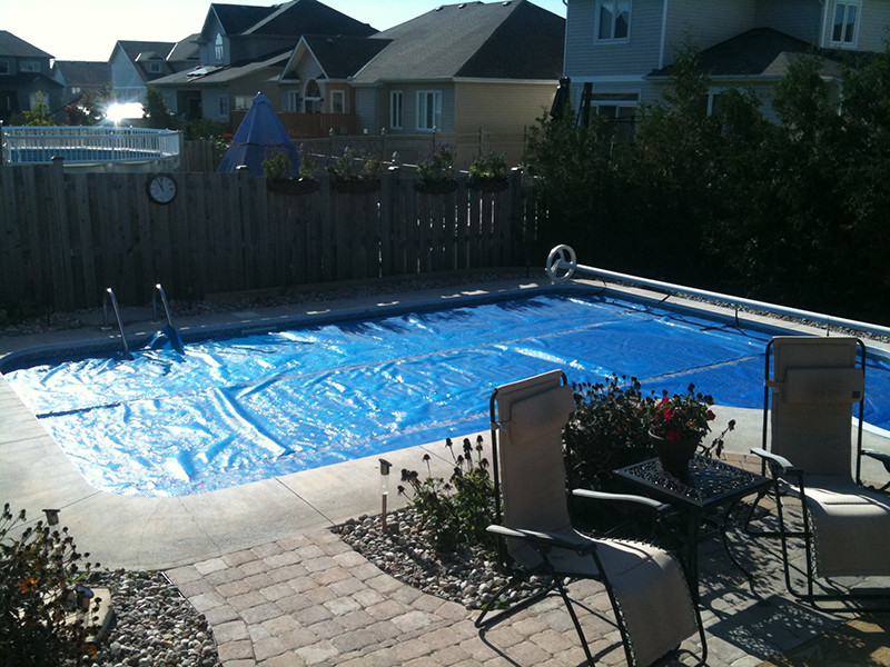 Pool - large traditional backyard stone and custom-shaped natural pool idea