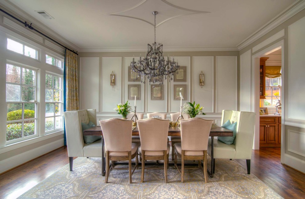 This is an example of a traditional dining room in Atlanta with beige walls, dark hardwood floors and no fireplace.