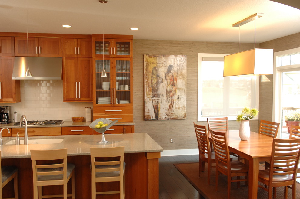 Mid-sized transitional dark wood floor eat-in kitchen photo with an undermount sink, shaker cabinets, medium tone wood cabinets, white backsplash, subway tile backsplash, stainless steel appliances, quartz countertops and an island