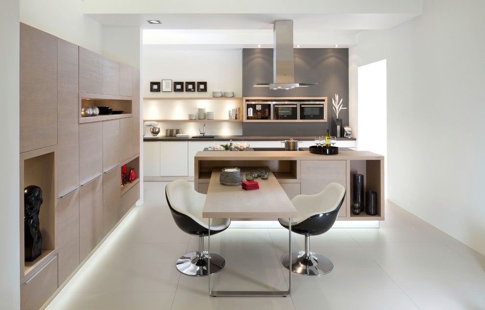 This is an example of a mid-sized contemporary eat-in kitchen in Miami.