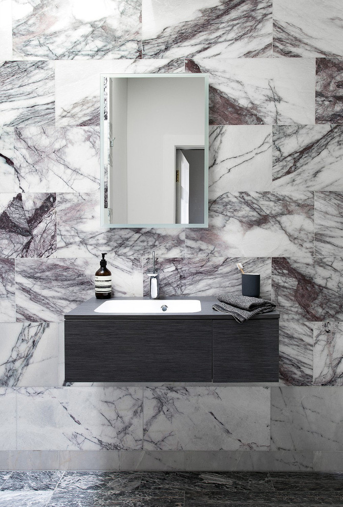 Inspiration for a small contemporary 3/4 wet room bathroom in Edinburgh with flat-panel cabinets, grey cabinets, a wall-mount toilet, black and white tile, marble, white walls, marble floors, a console sink, wood benchtops, grey floor, an open shower and grey benchtops.