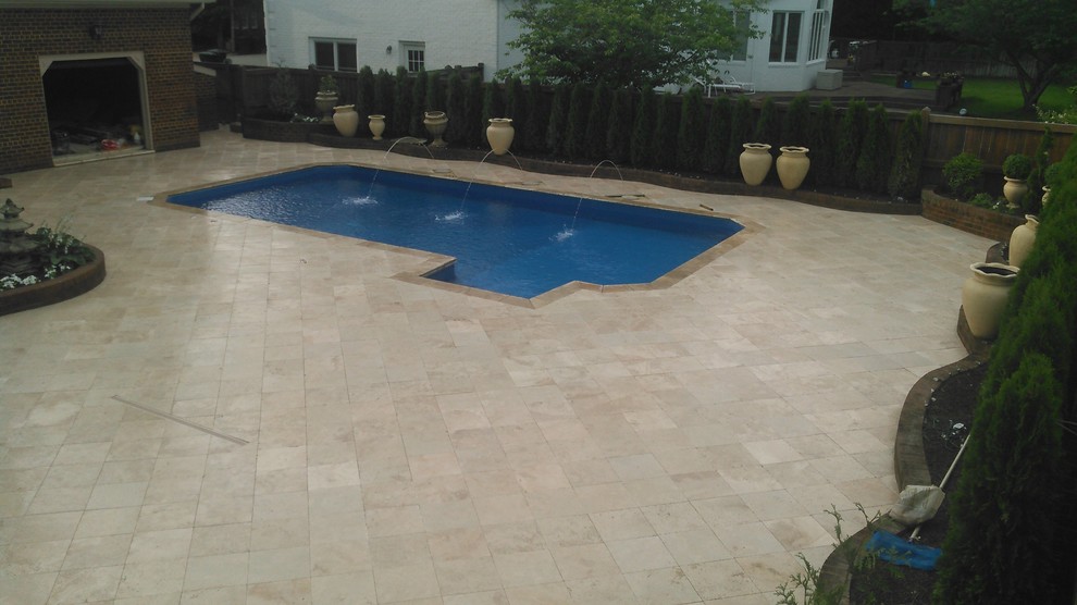 Inspiration for a mid-sized contemporary backyard stone and rectangular natural pool remodel