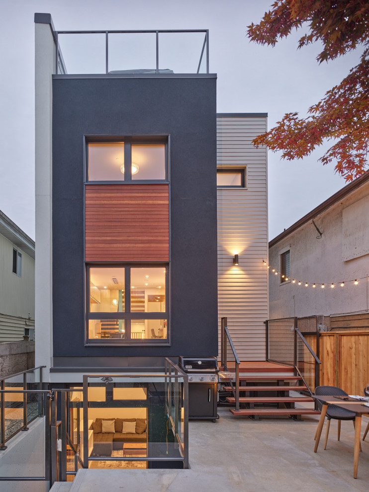 Modelo de fachada de casa gris retro de tres plantas