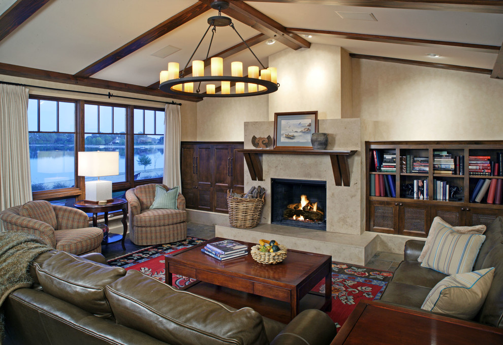 This is an example of a traditional living room in Omaha with beige walls and a standard fireplace.