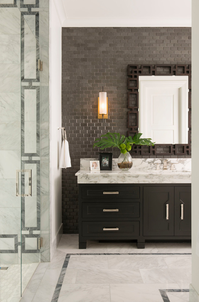 This is an example of a traditional master bathroom in Dallas with shaker cabinets, black cabinets, gray tile, white tile, grey walls, an integrated sink, multi-coloured floor, a hinged shower door and white benchtops.