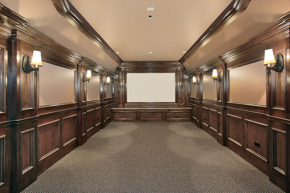 Inspiration for a mid-sized traditional enclosed home theatre in New York with brown walls and a projector screen.