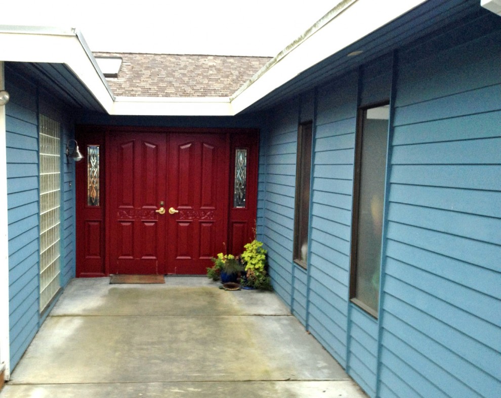 Puzzle front door w/adjacent opening windows