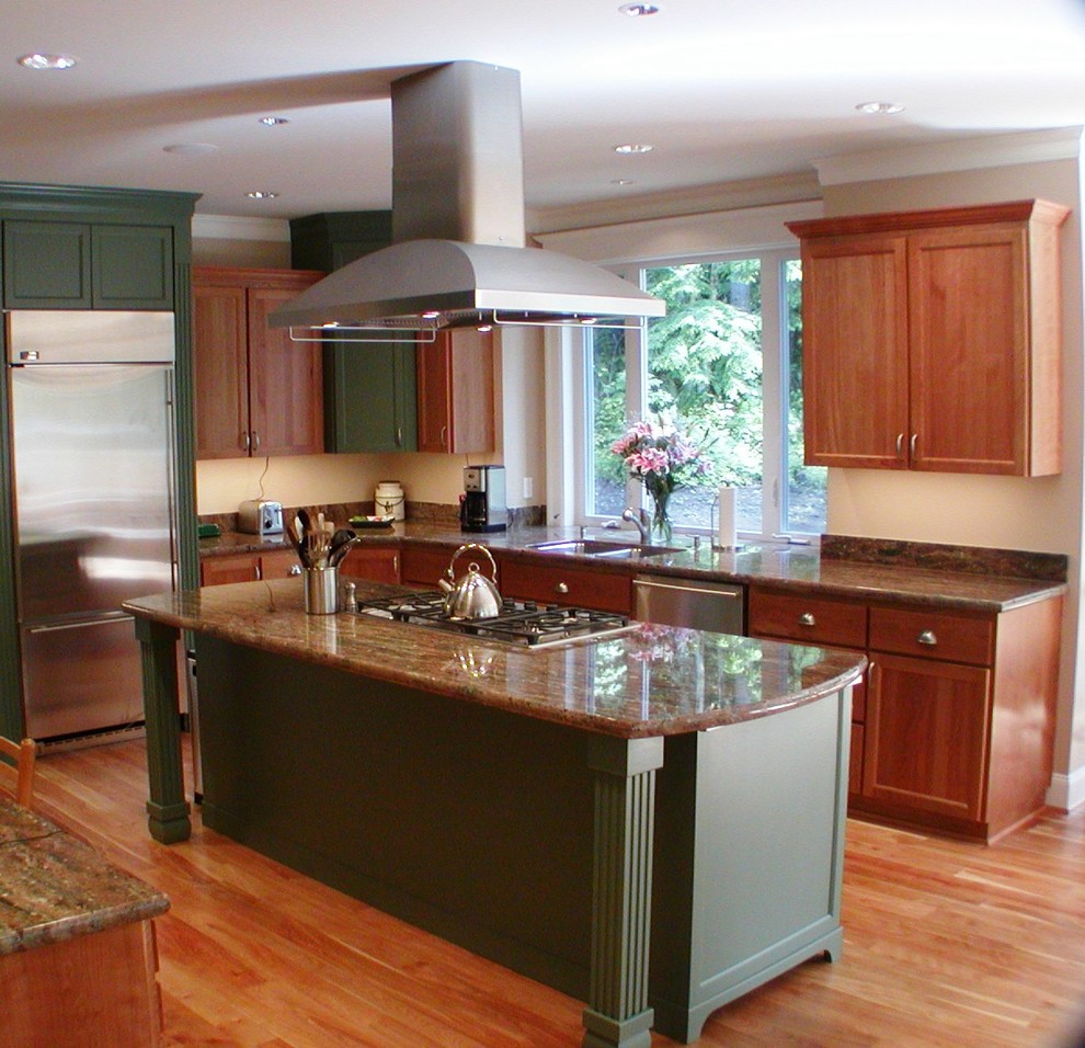 Mid-sized traditional u-shaped kitchen pantry in Seattle with an undermount sink, recessed-panel cabinets, medium wood cabinets, granite benchtops, green splashback, stone slab splashback, stainless steel appliances, medium hardwood floors and with island.