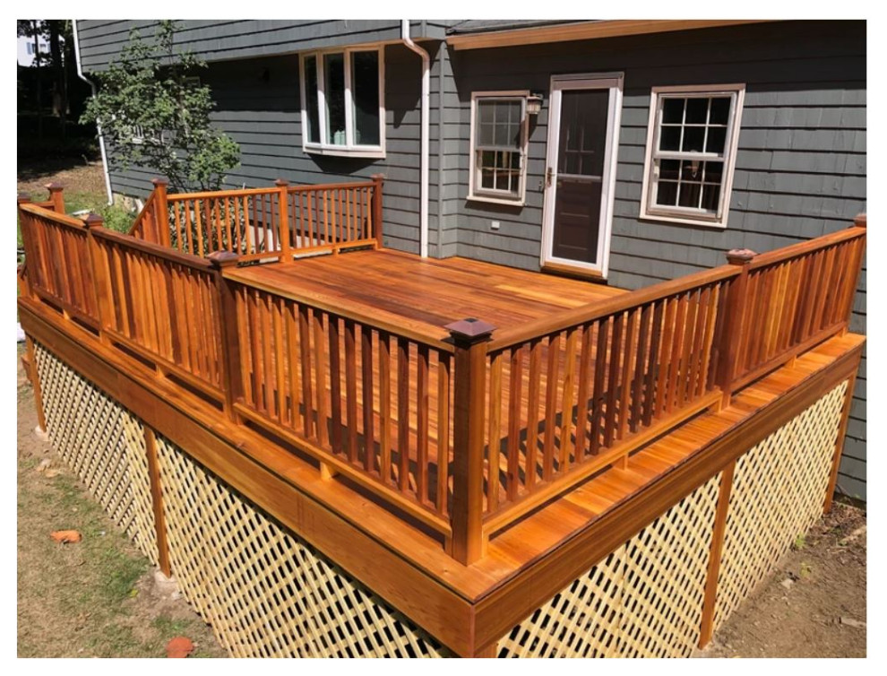 Backyard wood railing deck photo in Boston