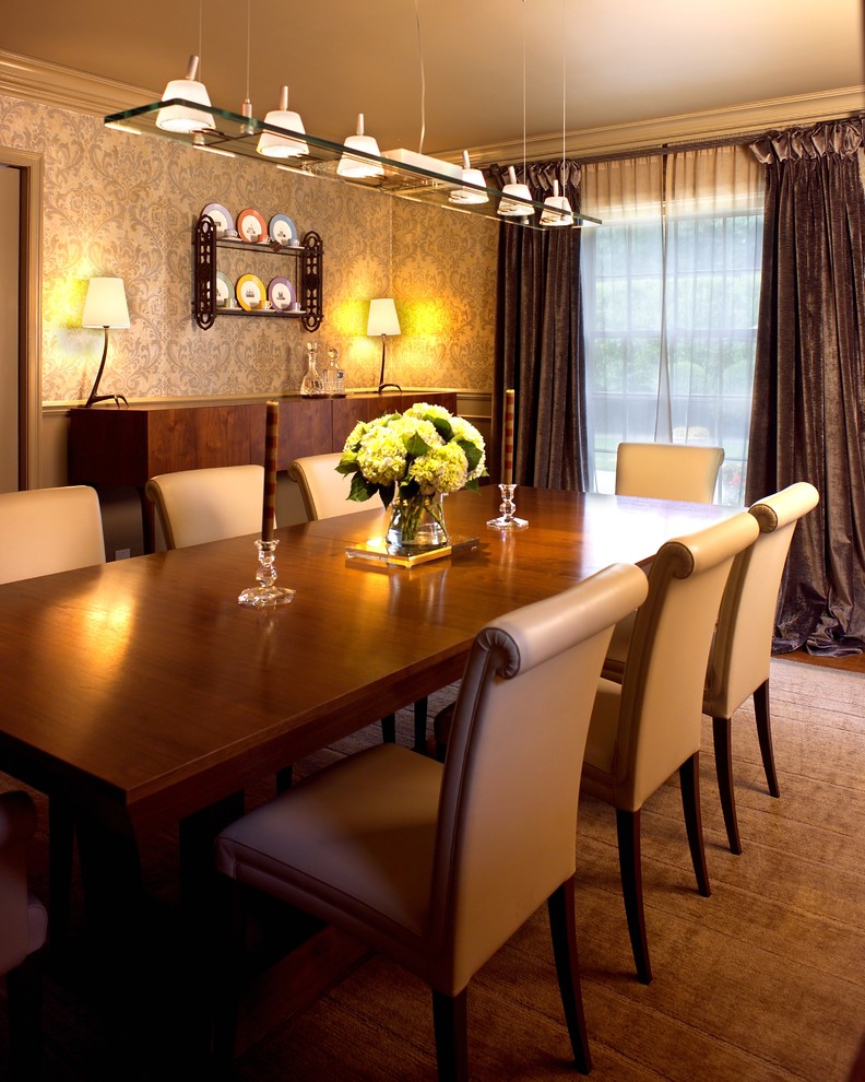 This is an example of a traditional separate dining room in Detroit with beige walls.