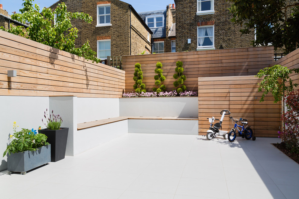 Inspiration for a contemporary backyard patio in London with no cover.