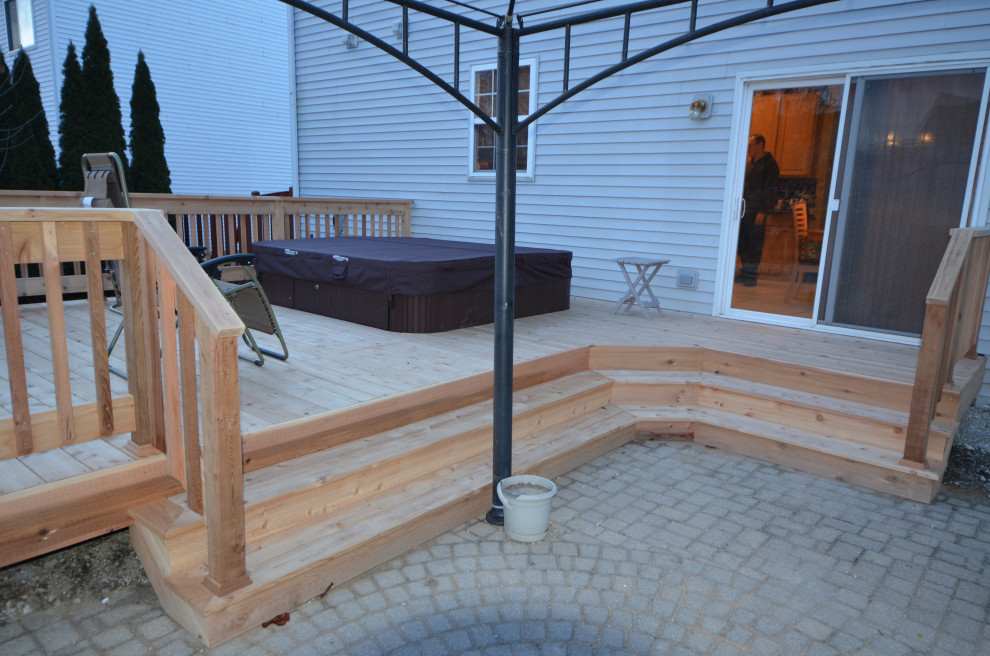 Mid-sized elegant backyard deck photo with no cover