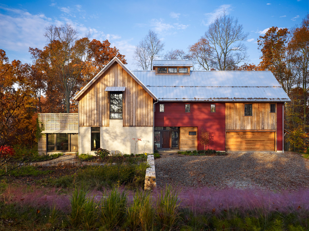 This is an example of a country exterior in Philadelphia with wood siding.