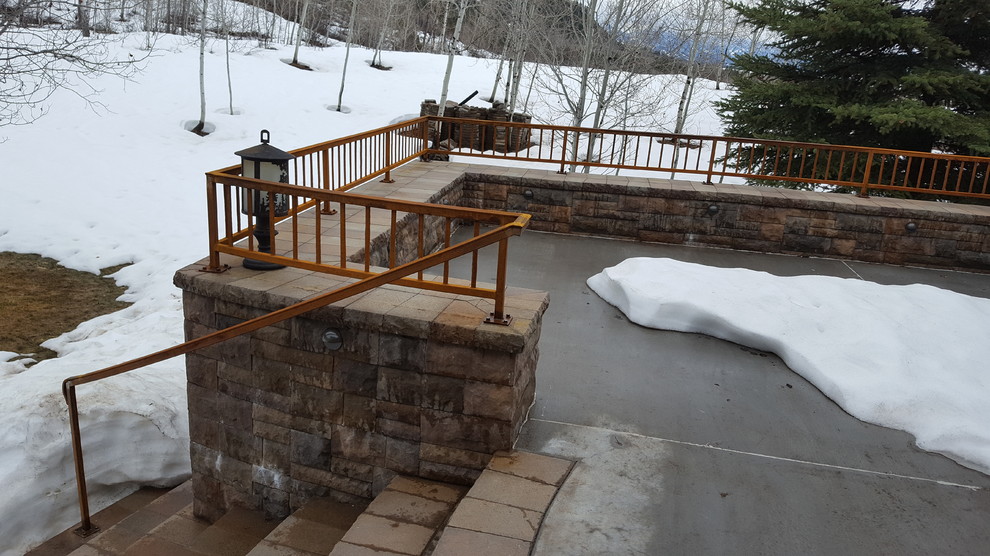 Deck - large rustic backyard deck idea with no cover