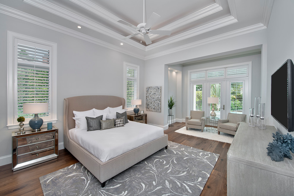 Design ideas for a traditional master bedroom in Miami with grey walls, dark hardwood floors and brown floor.