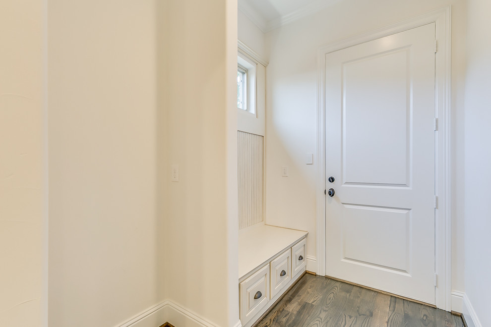 Inspiration for a small transitional mudroom in Dallas with beige walls, medium hardwood floors, a single front door and a white front door.