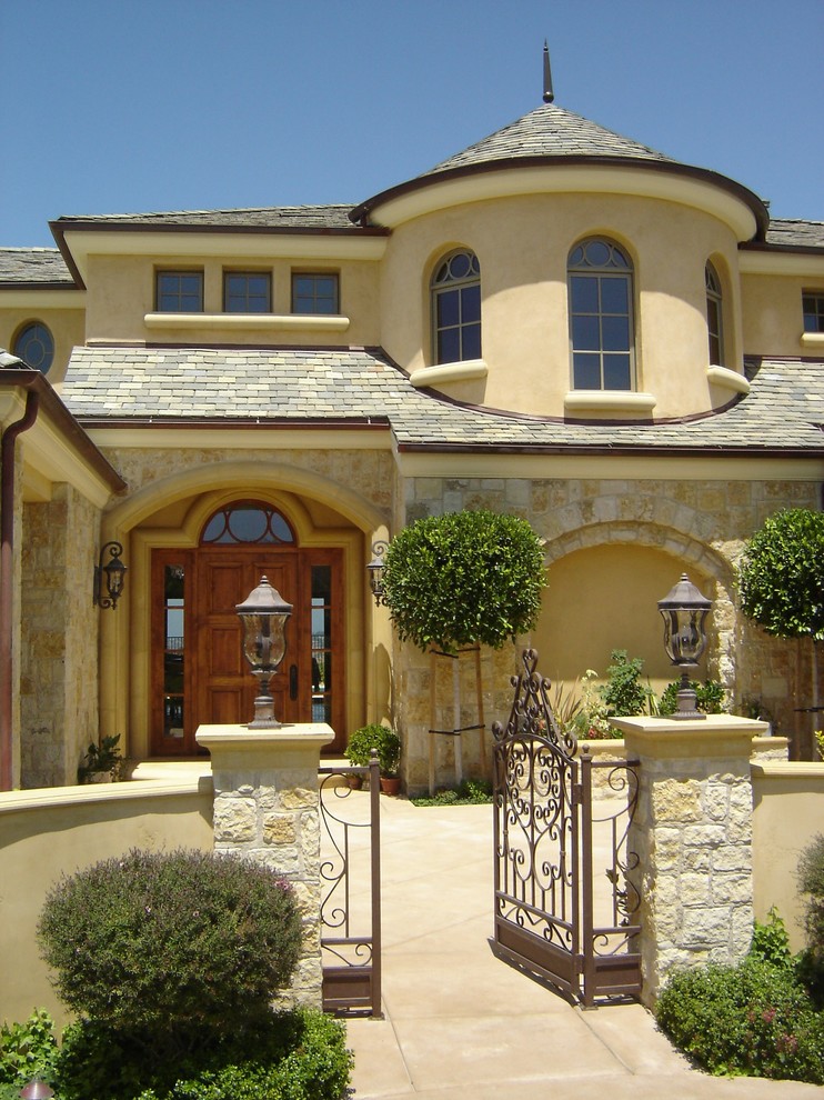 Design ideas for a mediterranean exterior in San Diego with stone veneer.