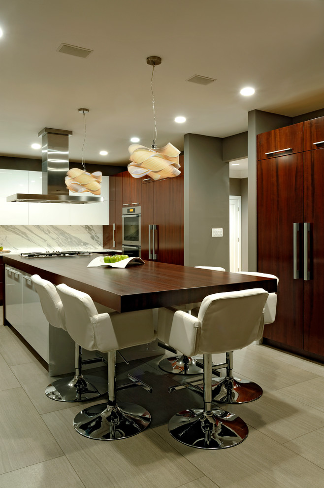 Design ideas for a large contemporary u-shaped eat-in kitchen in DC Metro with flat-panel cabinets, an undermount sink, dark wood cabinets, marble benchtops, white splashback, stone tile splashback, stainless steel appliances, linoleum floors and with island.