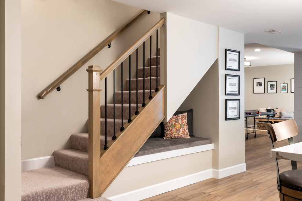 Large transitional staircase in St Louis with brick walls.