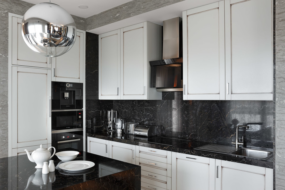 Inspiration for a contemporary l-shaped open plan kitchen in Moscow with a drop-in sink, recessed-panel cabinets, white cabinets, black splashback, black appliances and with island.