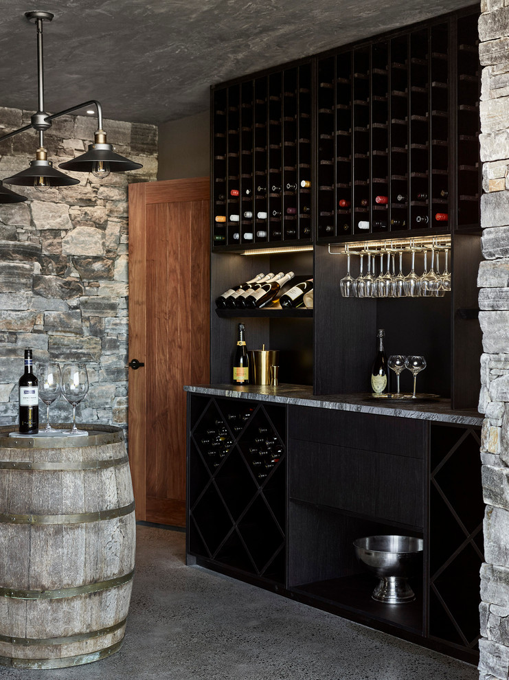 Modern wine cellar in Sunshine Coast with concrete floors, diamond bins and grey floor.