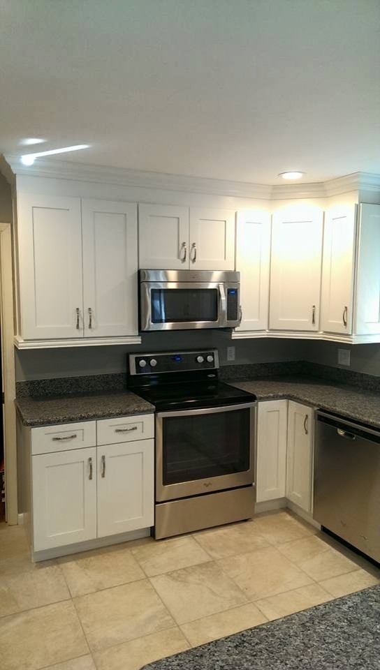 Inspiration for a mid-sized transitional u-shaped ceramic tile and beige floor eat-in kitchen remodel in Miami with a double-bowl sink, shaker cabinets, white cabinets, granite countertops, gray backsplash, stainless steel appliances, a peninsula and gray countertops