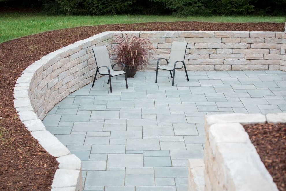 Inspiration for a mid-sized transitional backyard patio in Chicago with concrete pavers and no cover.