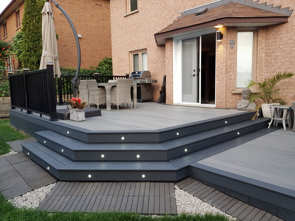 Deck - mid-sized modern backyard deck idea in Toronto with no cover