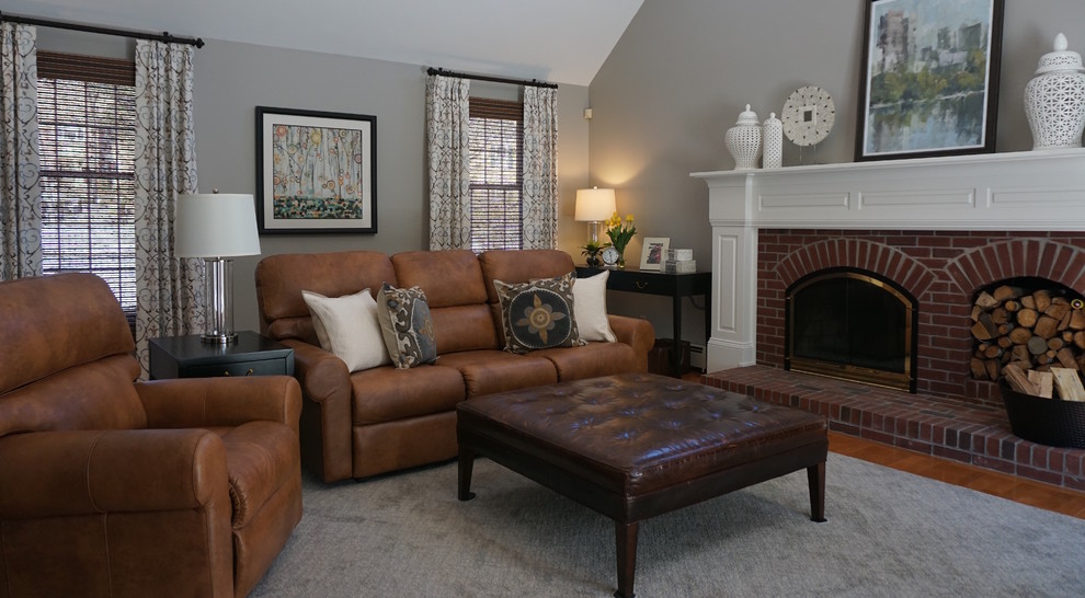 Photo of a large traditional enclosed living room in Boston with grey walls, medium hardwood floors, a standard fireplace and a brick fireplace surround.