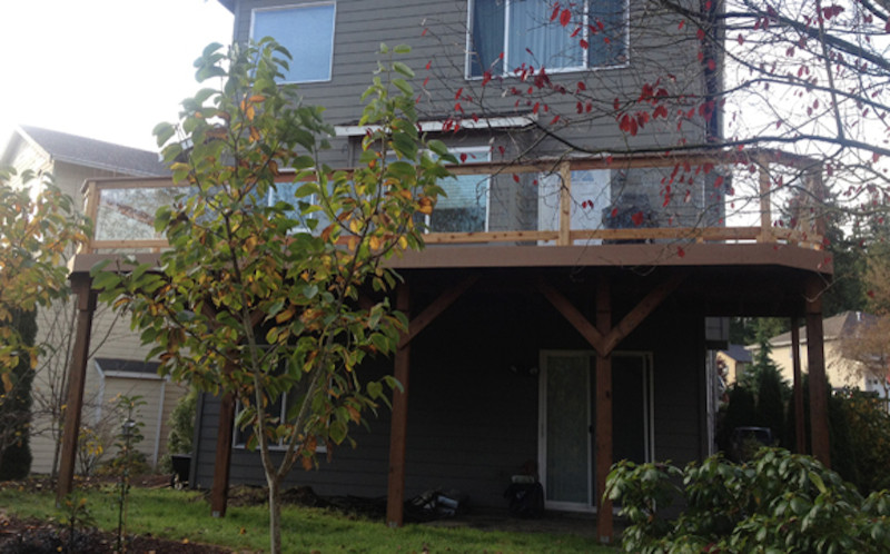 Mid-sized backyard balcony deck photo in Seattle with no cover