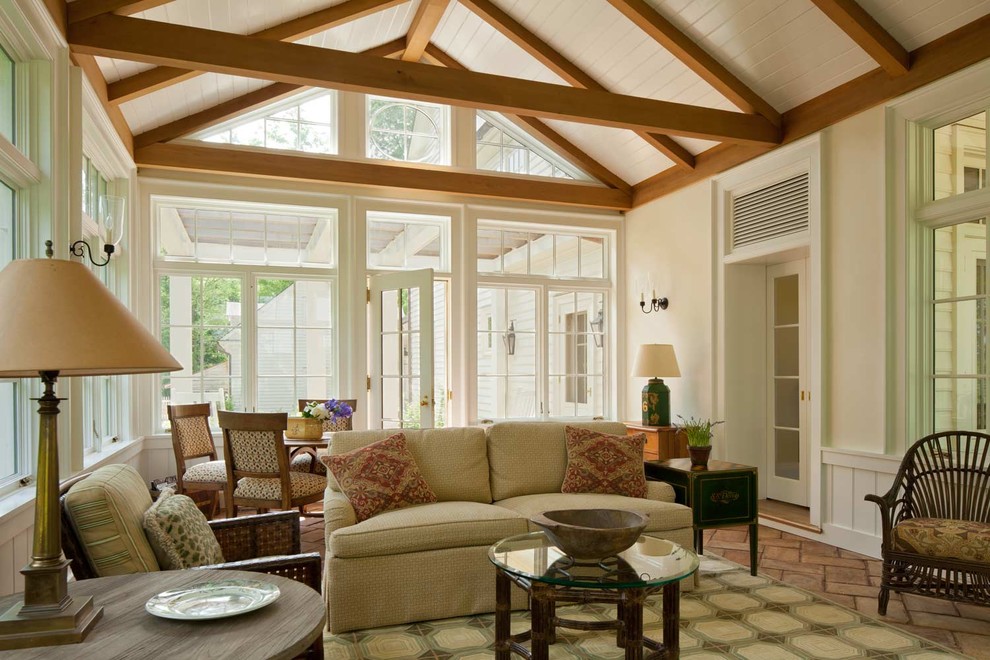 Inspiration for a mid-sized country enclosed family room in DC Metro with a game room, white walls, terra-cotta floors and no tv.