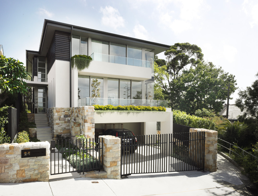 Inspiration for a large contemporary three-storey exterior in Sydney.