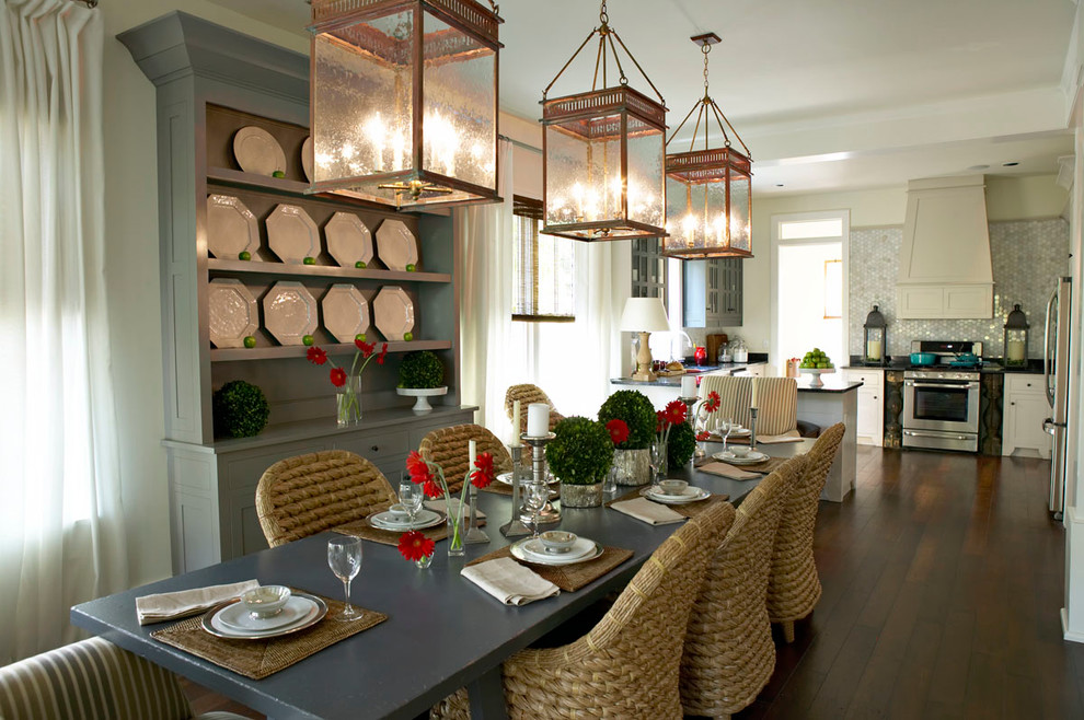 Inspiration for a mid-sized transitional u-shaped medium tone wood floor eat-in kitchen remodel with an integrated sink, beaded inset cabinets, white cabinets, metallic backsplash, stainless steel appliances and no island