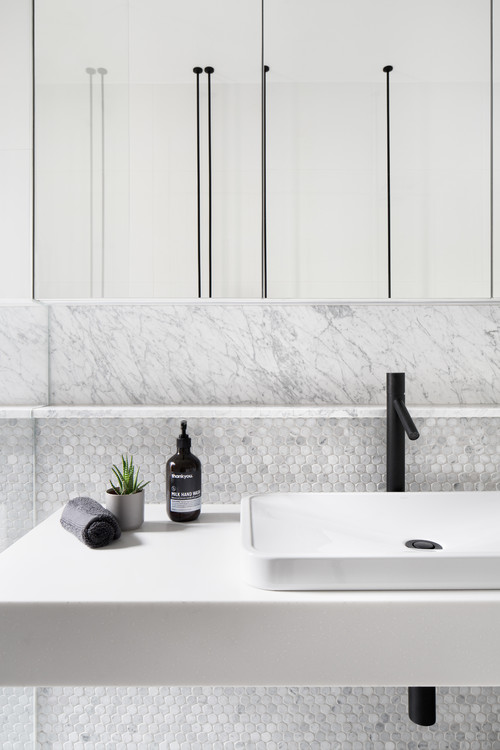 matt black mixer tap with matching pop up basin waste in black
