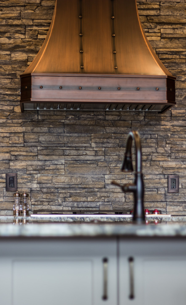 Example of a mountain style kitchen design in Denver