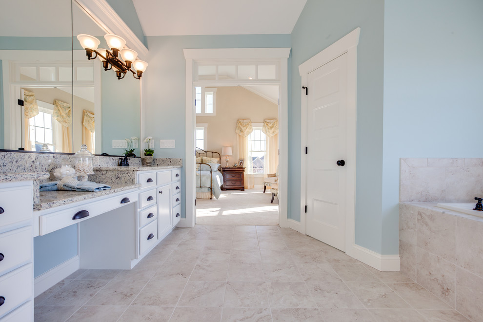 Inspiration for a large traditional master bathroom in Other with shaker cabinets, white cabinets, granite benchtops, a drop-in tub, a double shower, beige tile, ceramic tile, beige walls and ceramic floors.
