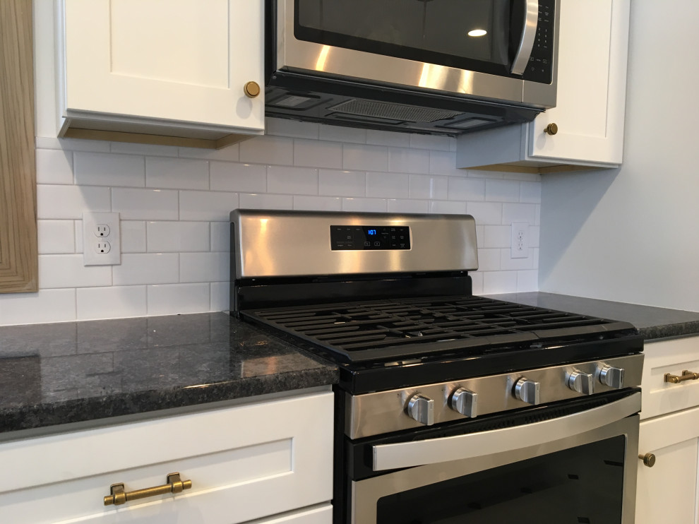 Quartz countertops with period subway backsplash