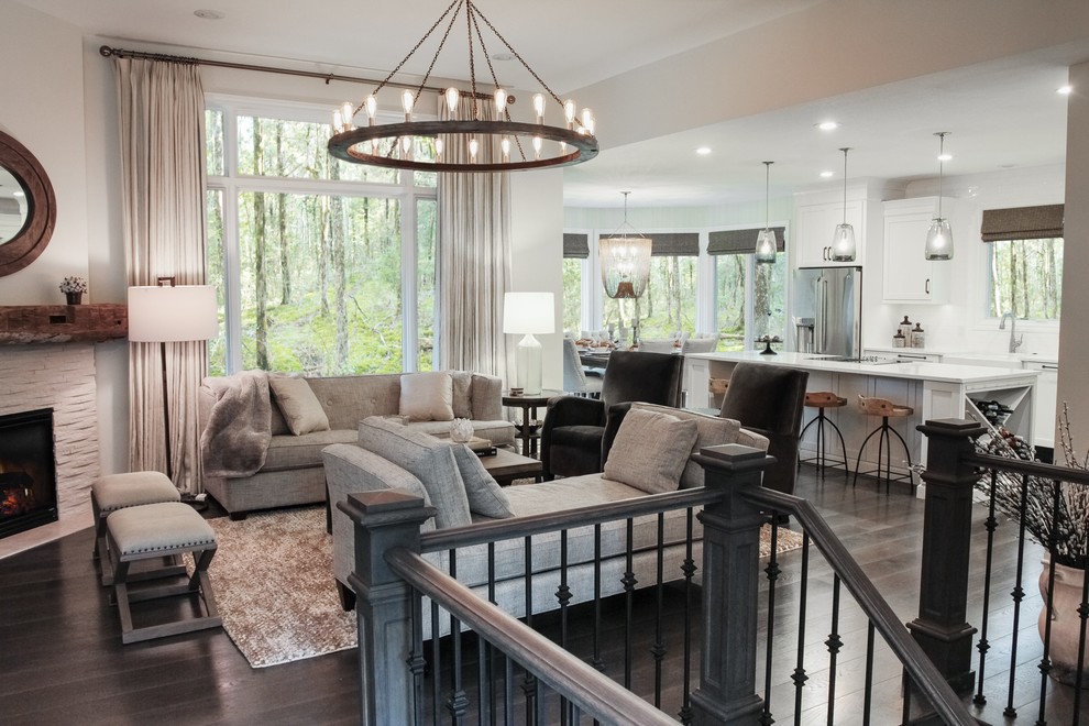 Mid-sized transitional open concept family room in Grand Rapids with grey walls, dark hardwood floors, a corner fireplace, a stone fireplace surround and a freestanding tv.