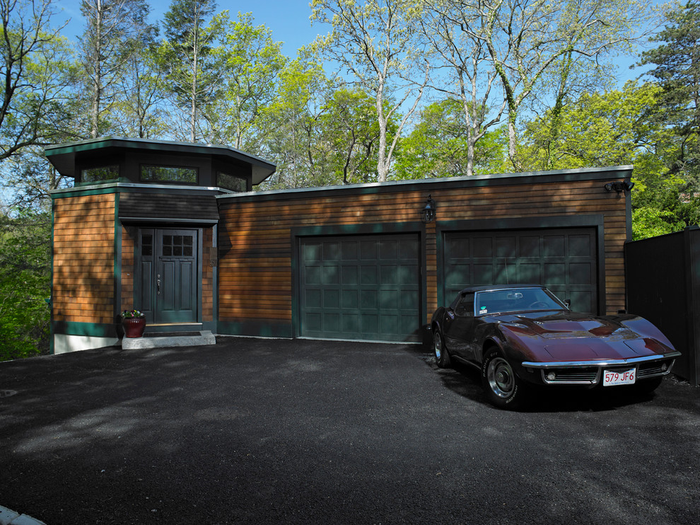 This is an example of a mid-sized contemporary garage in Boston.